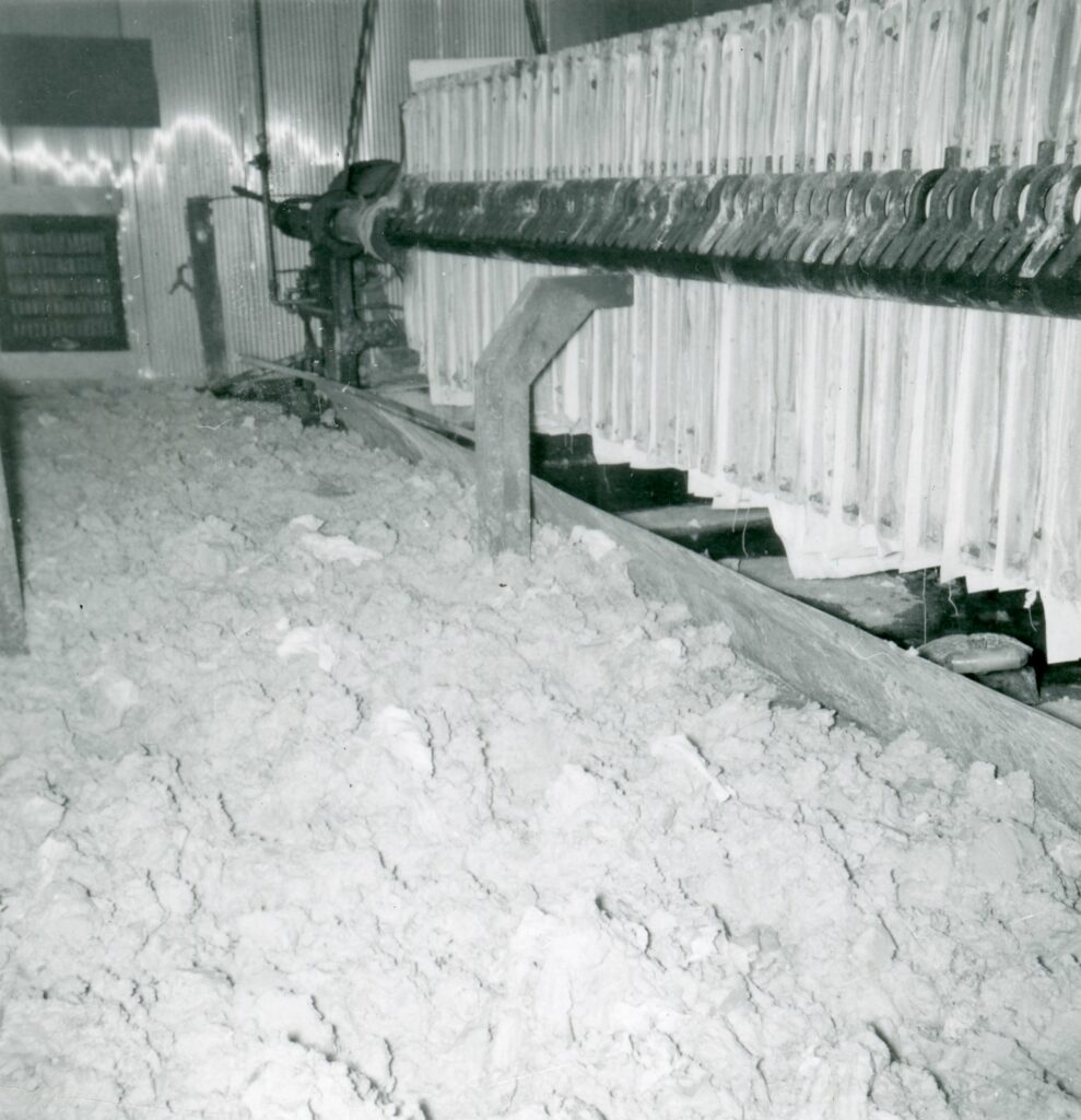 Black and white photo showing uranium processing