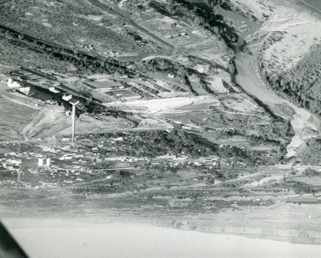 Aerial photo showing the Colorado River, and parts of Grand Junction, including the Climax Uranium Mill.