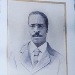 A man in a suit with a large mustache, Elijah Hines